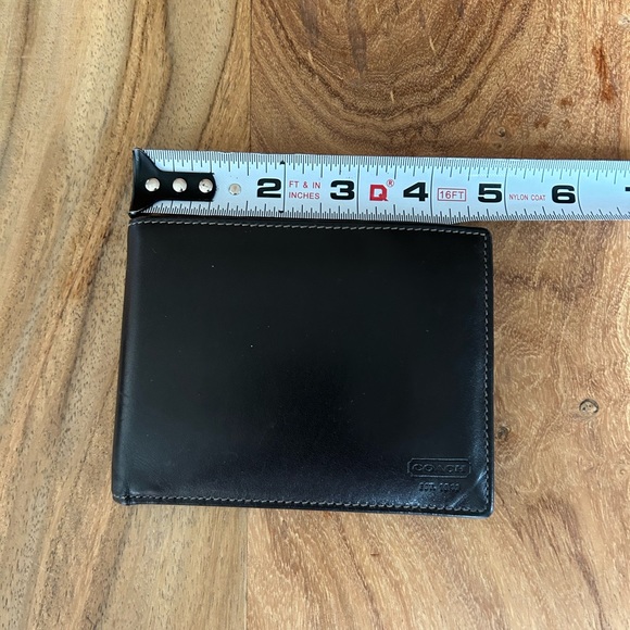 COACH men’s leather bifold wallet. Dark brown exterior blue interior like new
